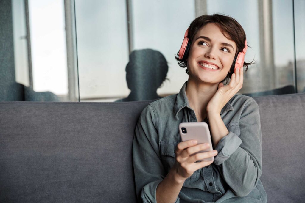 image-of-nice-young-smiling-woman-using-smartphone-Q3F9J7F.jpg